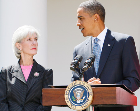 President Barack Obama stands with Health and Human Services Secretary Kathleen Sebelius stand together in the White House Rose Garden in September 2009. (AP/Charles Dharapak)