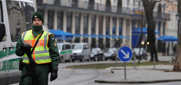 A police officers stands guard near the hotel "Bayerischer Hof" where politicians and military representatives will convene this weekend for the annual Munich Security conference. (AP/Christof Stache)