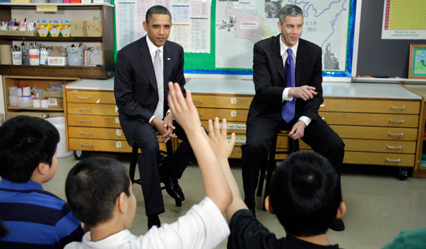 President Barack Obama sits with Education Secretary Arne Duncan speak to students at Graham Road Elementary School in Falls Church, Virginia earlier this year. (AP/Alex Brandon)