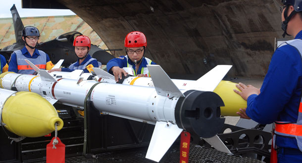 Members of the Taiwan Air Force set up a Tien Chien II missile during a media tour at Taichung airport, in Taiwan. China criticized the U.S. Tuesday ahead of the expected announcement of new arms sales to Taiwan, the latest in a series of disputes raising tensions between Washington and Beijing. (AP/Chiang Ying-ying)