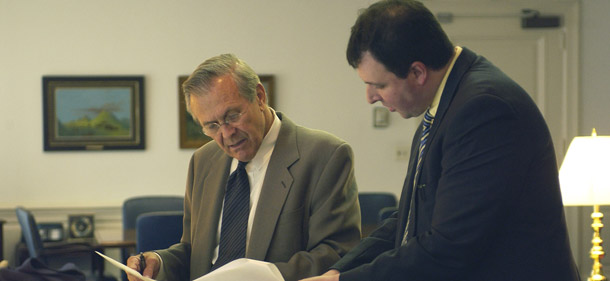 Mark Thiessen, right, pictured with Donald Rumsfeld in 2003, was recently hired by <i>The Washington Post </i>as an op-ed writer. Thiessen is a pro torture advocate who insisted that torturing Khalid Sheikh Mohammed in 2003 would have prevented a terrorist attack on Los Angeles's Library Tower in 2002. (AP/Sgt. Andy Dunaway)