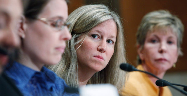 Peggy Robertson, a patient-health care consumer listens to testimony on Capitol Hill in Washington on October 15, 2009, during a Senate Health, Education, Labor and Pensions Committee hearing on the gap in health care costs and coverage between men and women in America. (AP/Haraz N. Ghanbari)