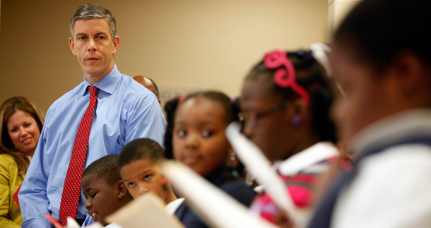 U.S. Education Secretary Arne Duncan listens to fourth graders read at Delaplaine McDaniel Elementary School in Philadelphia, as part a "listening and learning" tour to find out what school strategies are working and why. (AP/Matt Rourke)