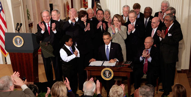 President Barack Obama signs the health care reform bill, Tuesday, March 23, 2010, in the East Room of the White House. (AP/Charles Dharapak)