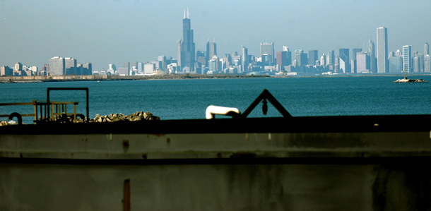 A portion of tank at the BP waste water treatment plant is shown in the foreground with the Chicago skyline in the background. (AP/Joe Raymond)