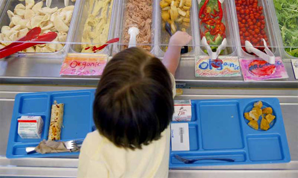 Students select their lunches at Lincoln Elementary in Olympia, WA. The government must address hunger and nutrition problems in the United States, but it should do so as efficiently as possible. (AP/John Froschauer)