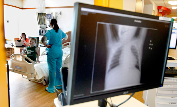 A chest x-ray appears on a portable computer outside a room at Children's Hospital in Pittsburgh, Pennsylvania. (AP/Keith Srakocic)