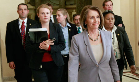 Speaker Nancy Pelosi walks to the floor as the House prepares to vote on health care reform on Sunday, March 21, 2010. (AP/Alex Brandon)