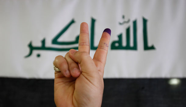 An Iraqi man flashes a V sign after casting his vote at an early voting polling center. Iraqis are set to go to the polls on Sunday, March 7 for the second election of a full parliamentary term since the 2003 U.S.-led invasion ousted Saddam Hussein. (AP/Bilal Hussein)