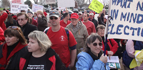 Conservative groups hold a rally against government health care on Capitol Hill. Anyone concerned about our budget situation but opposed to health reform must answer this question: In the absence of health care reform, what other policies do you support that will reduce the deficit by at least $1 trillion over the next two decades? (AP/Lauren Victoria Burke)