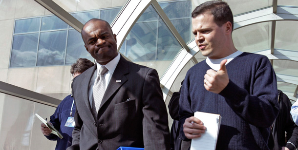 Reporters question NFL Players Association executive director DeMaurice Smith as he leaves a meeting with the NFL Competition Committee in Indianapolis on February 25, 2010. (AP/Michael Conroy)