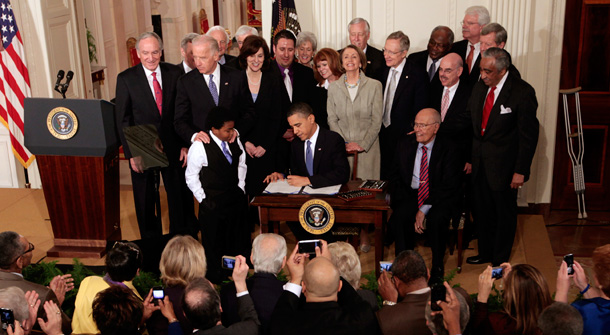 President Barack Obama signs the health care reform bill on Tuesday, March 23, 2010 in the East Room of the White House. (AP/Charles Dharapak)