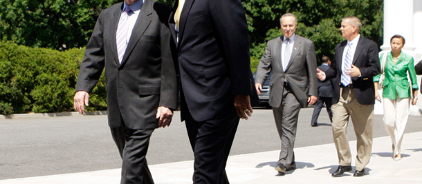 Sens. Charles Schumer and Lindsey Graham confer while walking out of a meeting at the White House with President Barack Obama about immigration reform.
<br /> (AP/Haraz N. Ghanbari)