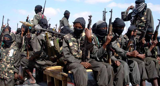 Armed fighters from Somalia's Al Shabab jihadist movement travel on the back of pickup trucks outside Mogadishu. Small arms proliferation threatens development and security worldwide, and there are four specific steps the United States can take in the short term to help promote strategic engagement on the issue. (AP/Farah Abdi Warsameh)