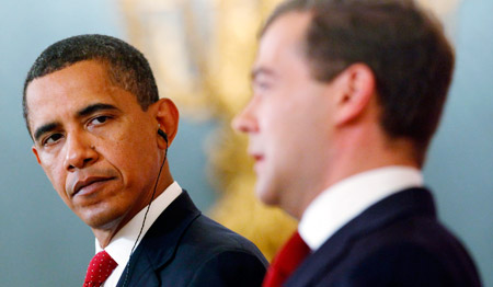 President Barack Obama listens as Russian President Dmitry Medvedev speaks during a joint press conference following the signing of the Joint Understanding for the START Follow-on Treaty in Moscow last July. (AP/Haraz N. Ghanbari)