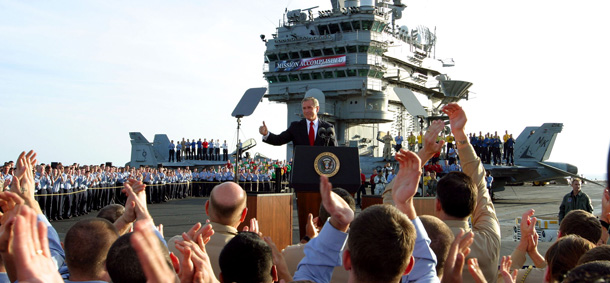 President Bush gives a "thumbs-up" sign after declaring the end of major combat in Iraq on May 1, 2003. (AP/J. Scott Applewhite)