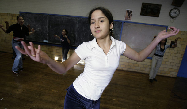 A student participates in a Latin dance class as part of the extended school day at Edwards Middle School in Boston. (AP/Michael Dwyer)