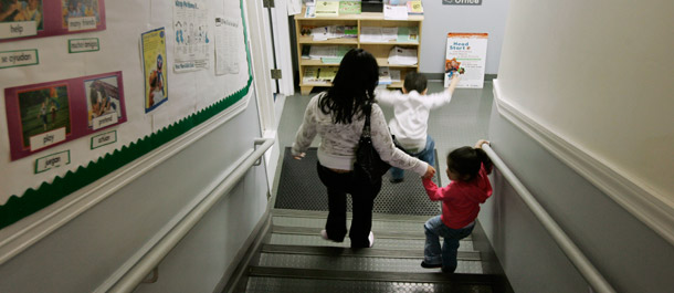 Michelle Ramirez picks her children up at a day care center in Chicago where she is a single mother and works as a receptionist to support her two children. (AP/Charles Rex Arbogast)