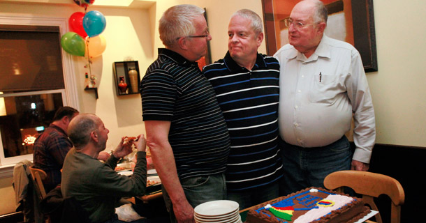 Bill Fuchs, 61, left, attends a birthday party for his partner Gerry Beaulieu, 62, with Carl Martin, 83, right, in Washington. D.C. (AP/Jacquelyn Martin)