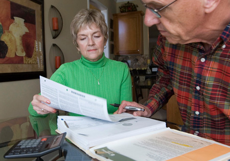 A couple in Breselton, Georgia reviews their financial statements. (AP/John Amis)