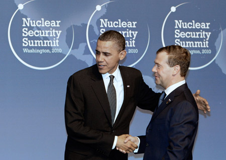 U.S. President Barack Obama welcomes Russian President Dmitry Medvedev during the official arrivals for the Nuclear Security Summit in Washington. (AP/RIA Novosti)