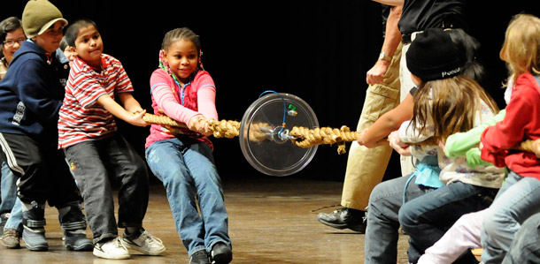 Elementary school children take part in a physics demonstration in Minneapolis, Minnesota. In the tug of war between innovation and the status quo, it's clear we need a transformation. (AP/Jim Mone)