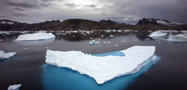 Icebergs float in a bay off Ammassalik Island in Greenland in 2007. The science behind global warming remains unchanged despite media distortions, and predictions include threats to species due to the loss of Arctic sea ice as well as rising sea levels. (AP/John McConnico)