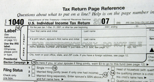 A close up of a federal income tax form is seen at post office in Palo Alto, CA. The government uses tax expenditures to accomplish the same goals as direct spending, but it transfers money by lowering taxes for an individual or company instead of giving them the money. (AP/Paul Sakuma)