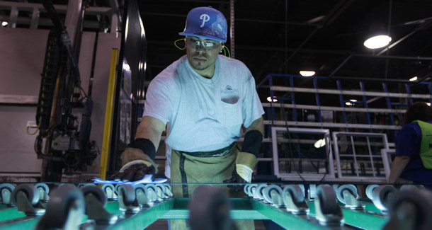 A workman takes part in the manufacturing of windows at Northeast Building Products in Philadelphia on April 2, 2010. The labor market is finally adding jobs at an accelerating pace, but there are a number of trouble spots that require policy attention to ensure a strong and durable recovery for years to come. (AP/Matt Rourke)