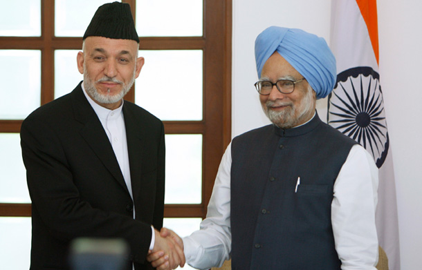 Afghan President Hamid Karzai, left, and Indian Prime Minister Manmohan Singh shake hands after addressing the press in New Delhi, India, on April 26, 2010. India, along with Pakistan, must set aside their differences and help stabilize Afghanistan.
<br /> (AP/Saurabh Das)