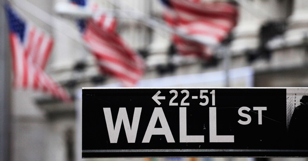 A Wall Street sign is shown in front of the New York Stock Exchange. The bank tax presents Congress with the opportunity to move on good job creation ideas while offsetting their costs using revenues from a tax levied on the very financial institutions that helped put us in this situation. (AP/Mark Lennihan, file)