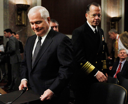 Defense Secretary Robert Gates and Joint Chiefs Chairman Adm. Michael Mullen arrive on Capitol Hill in February to testify before a Senate Armed Services Committee hearing on 