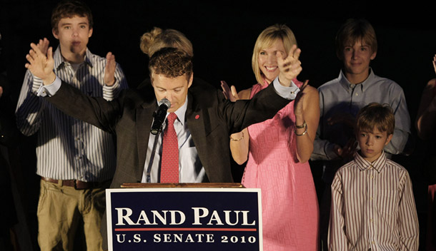 Republican Senate candidate Rand Paul raises his arms to the cheers of supporters at his primary victory party in Bowling Green, KY on May 18, 2010. Paul is one of several winning Tea Party candidates in the midterm election primaries. (AP/Ed Reinke)