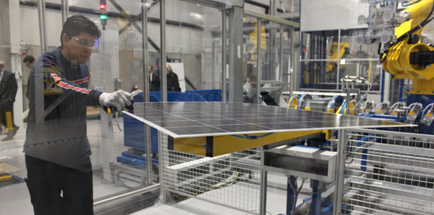 The recently introduced SEAM Act would expand a manufacturing tax credit for clean energy companies like Schott Solar in Albuquerque, New Mexico, which manufactures photovoltaic panels. (AP/Susan Montoya Bryan)