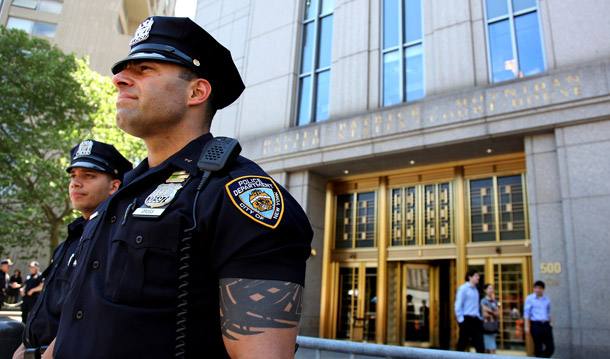 Police officers stand watch in front of the United States Court House in New York on May 4, 2010. Times Square car bomb suspect Faisal Shahzad, who was arrested at New York's Kennedy Airport late Monday, is scheduled to appear in the court building sometime today. (AP/Craig Ruttle)