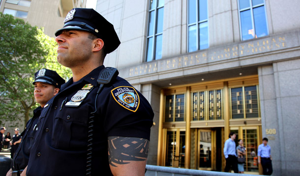 Police officers stand watch in front of the United States Court House in New York on May 4, 2010. Times Square car bomb suspect Faisal Shahzad, who was arrested at New York's Kennedy Airport late Monday, is scheduled to appear in the court building sometime today. (AP/Craig Ruttle)