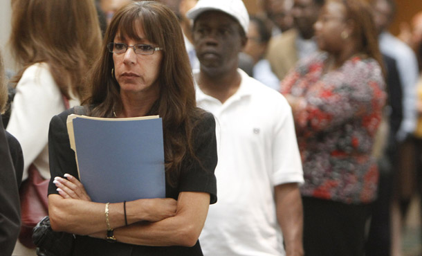 A woman stands in line at the National Career Fair in Fort Lauderdale, FL, on May 3, 2010. Data released last week by the Bureau of Labor Statistics show unmarried women continue to see high and long-lasting unemployment. (AP/J Pat Carter)