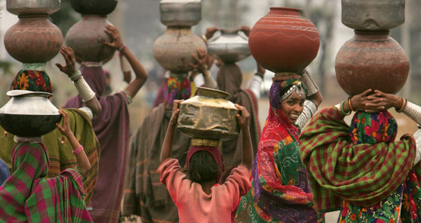 Women are at the heart of their families’ and communities’ resource management and well-being, and should be full participants in global climate change negotiations. (AP//Gurinder Osan)