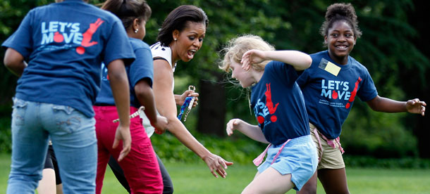 First lady Michelle Obama plays with children on the South Lawn of the White House in Washington as part of Let's Move. (AP/Carolyn Kaster)