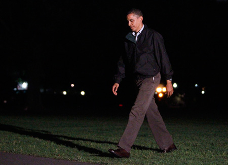 President Barack Obama walks across the South Lawn after returning from a trip to the Gulf Coast. (AP/Alex Brandon)