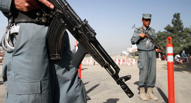 Afghan policemen stand guard at the check point of the peace jirga tent at Kabul Polytechnic University on June 1, 2010. (AP/Musadeq Sadeq)