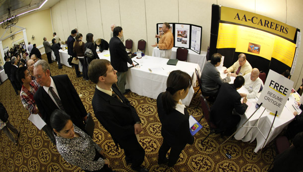 Job seekers line up for a resume critique at a career fair put on by National CareerFairs in San Jose, CA. Jobless claims were up last week and are essentially flat for all of 2010, which is alarming when coupled with the weak private sector job growth in May. (AP/Eric Risberg)