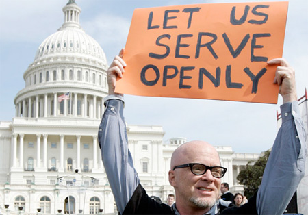 Man takes part in a rally in front of the Capitol supporting efforts to repeal