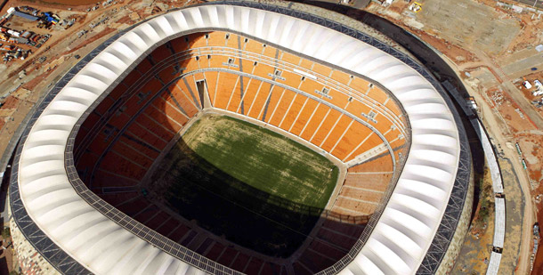 An aerial view is seen of Soccer City in Johannesburg, South Africa, which hosts both the opening and final matches of the 2010 World Cup. The stadium's construction incorporated recycled rubble, and it will use captured rainwater and nonpotable, recycled water for irrigation and other purposes. (AP/Themba Hadebe)