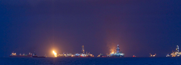 Vessels operate in the area of the Deepwater Horizon disaster on the Gulf of Mexico. BP reported on Thursday, July 15 that it finally stopped oil from leaking out of the blown-out well. (AP/Dave Martin)