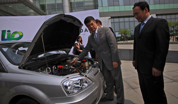 Some companies, like California's Coda Automotive pictured here at their factory in China, have managed to cross China's protectionist barrier because their primary market is the United States. But a larger problem remains for American companies: the lack of develpoment at home leaves little opportunity to actually invest here. (AP/Muhammed Muheisen)