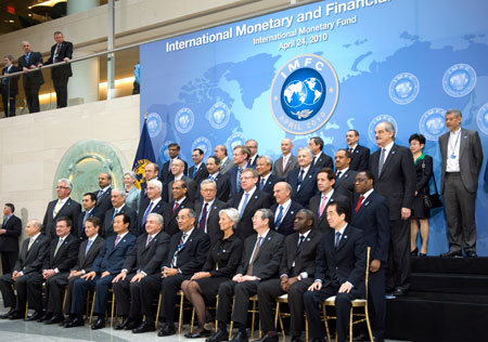 The finance ministers and central bank governors of the International Monetary and Financial Committee pose for a group photo during the G-20 meeting of Finance Ministers and Central Bank. (AP/Cliff Owen)
