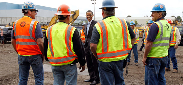 President Barack Obama talks with construction workers helping to build the new Solyndra, Inc. solar panel manufacturing facility in Fremont, California. (AP/Alex Brandon)