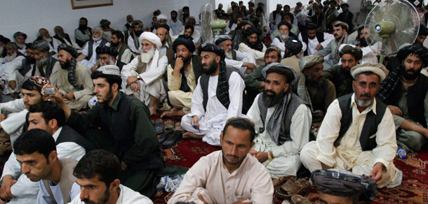 Afghans listen to President Hamid Karzai during a gathering in Kandahar on June 13, 2010. Many Afghan communities are frustrated, feeling marginalized from decision making with no means to hold the government accountable. (AP/Allauddin Khan)