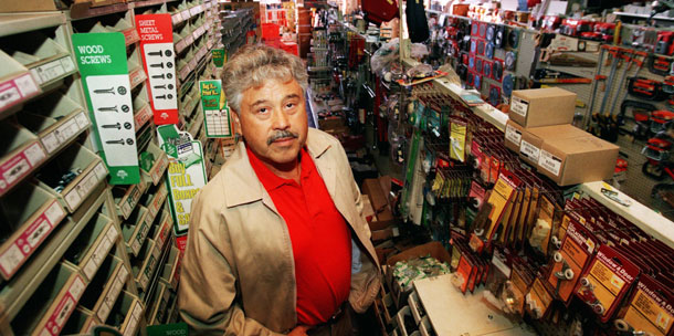 Small business owners, like this California hardware store owner, might no longer be able to offer health insurance to employees if health care reform is repealed. (AP/Reed Saxon)